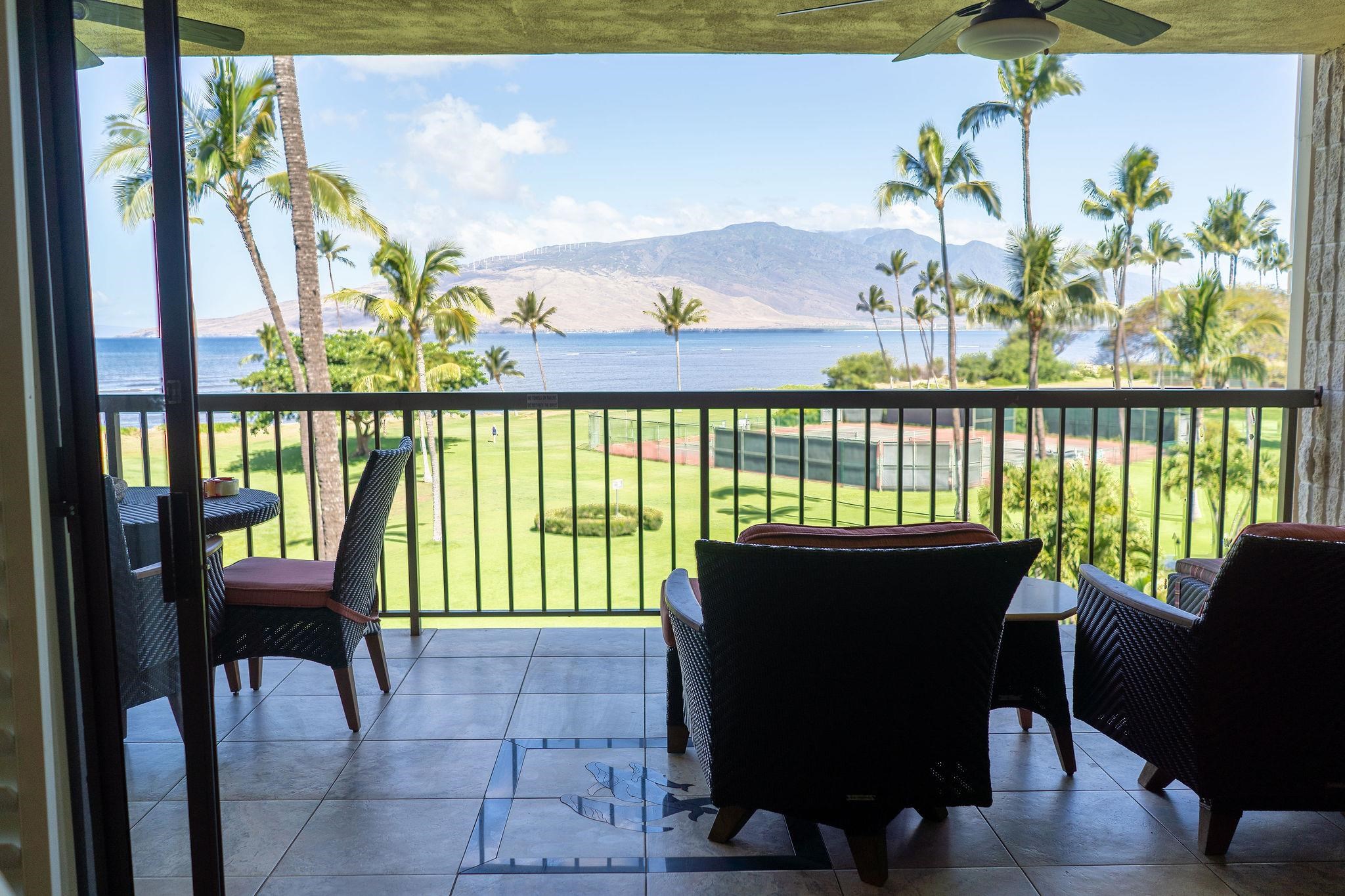 a view of a chairs and table in patio