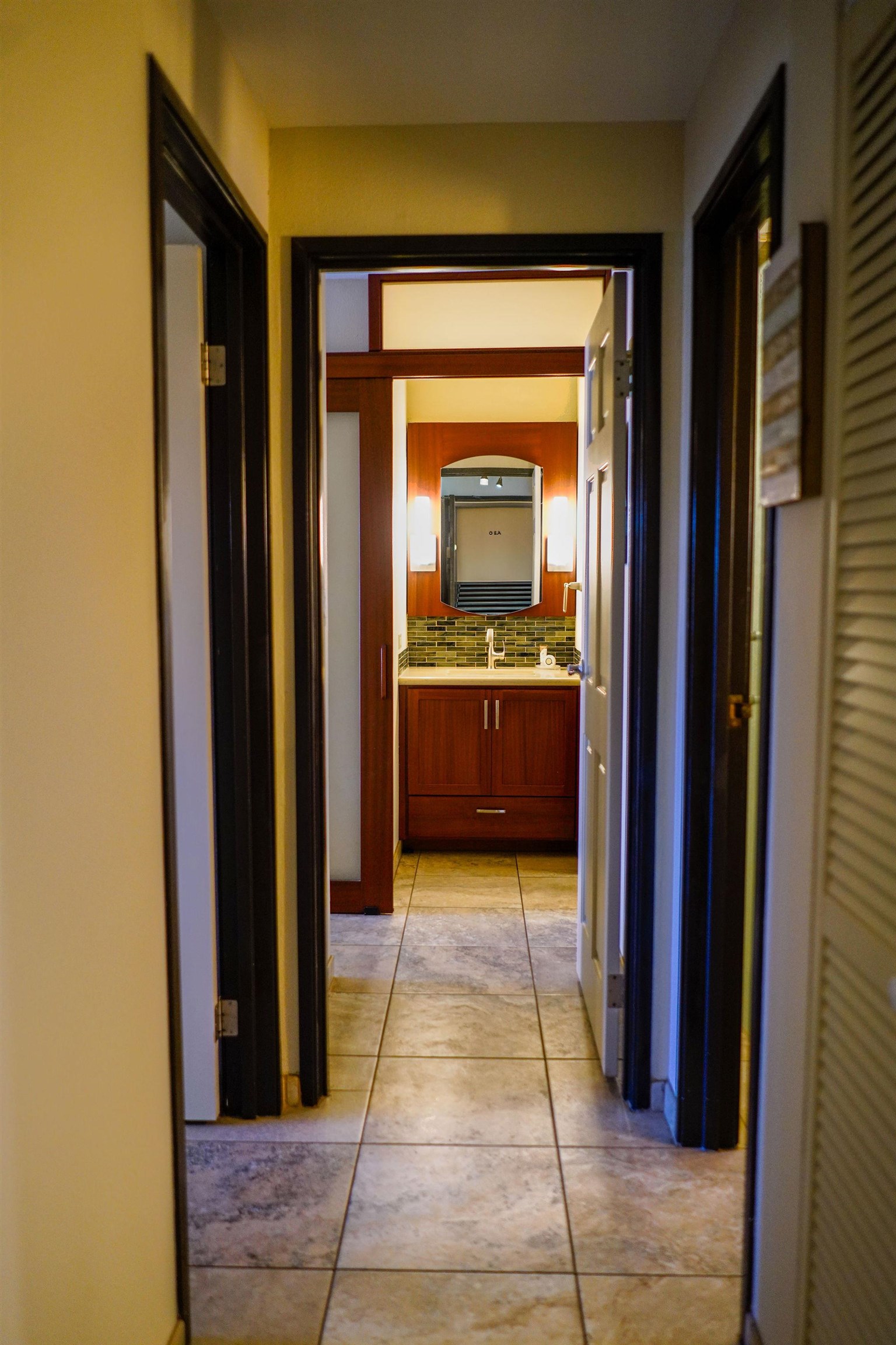 1032 South Kihei Road, Unit B420 Kihei, HI 96753 - Photo 11 of 47 a view of a hallway with wooden shelves