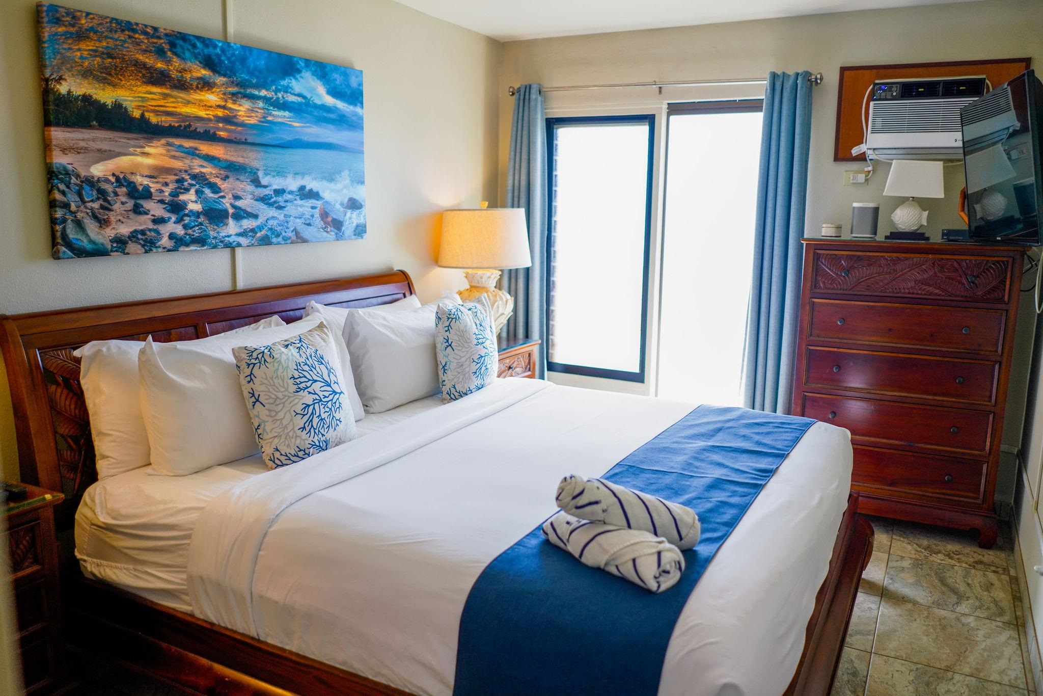 1032 South Kihei Road, Unit B420 Kihei, HI 96753 - Photo 12 of 47 a bedroom with a bed and dresser
