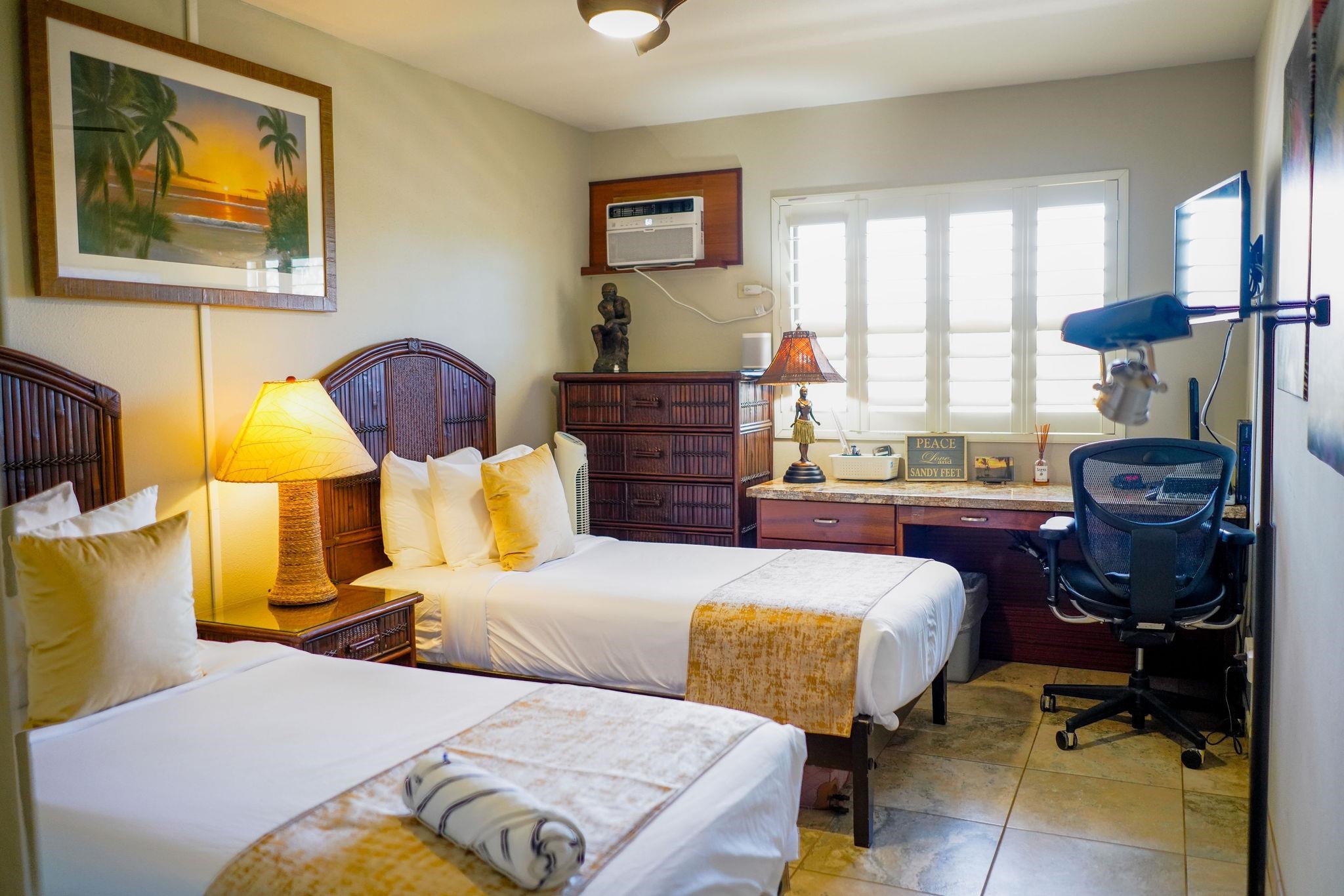 1032 South Kihei Road, Unit B420 Kihei, HI 96753 - Photo 16 of 47 a bedroom with a bed and wooden floor