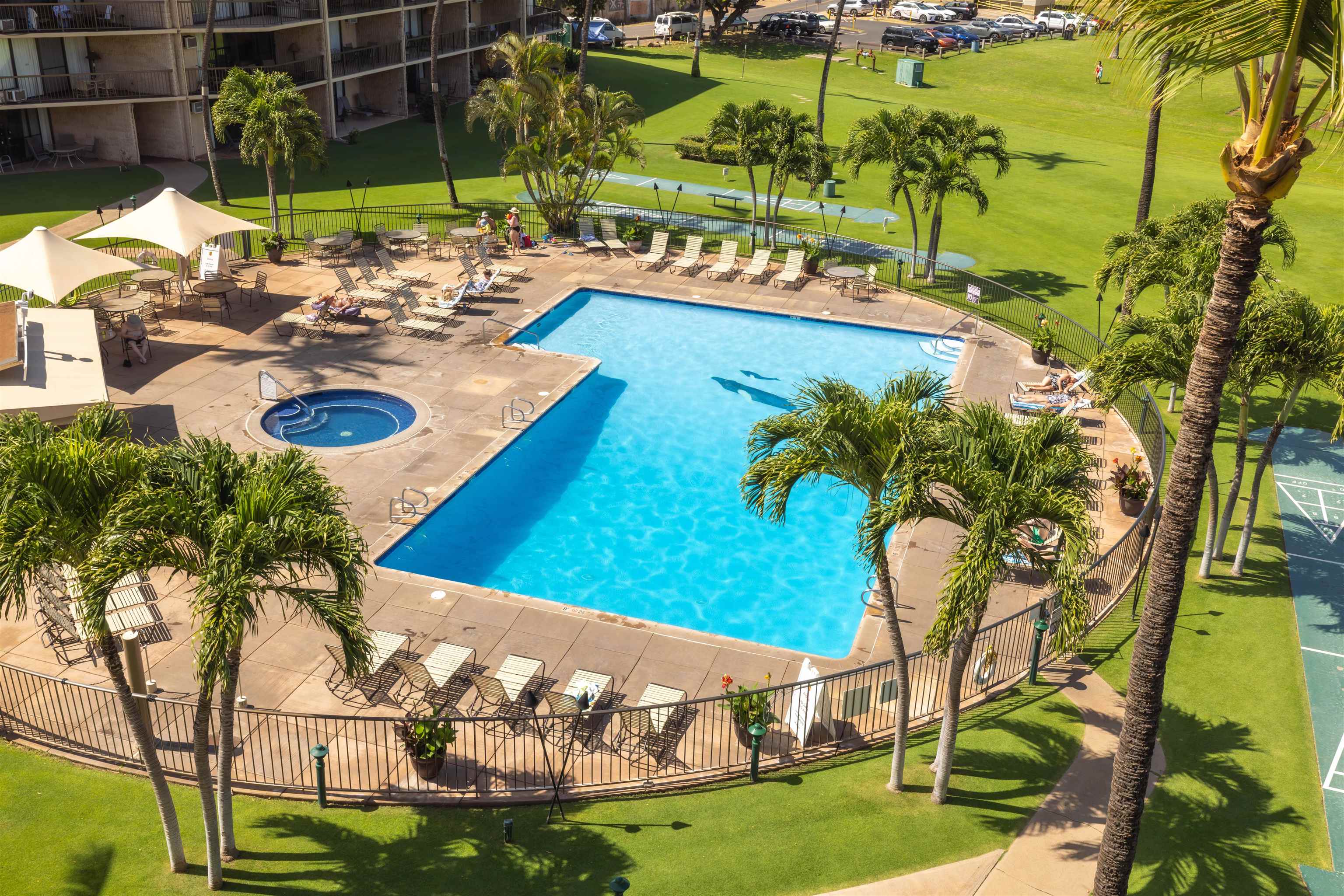 1032 South Kihei Road, Unit B420 Kihei, HI 96753 - Photo 28 of 47 a view of a swimming pool with a yard