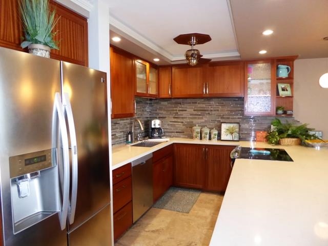 1032 South Kihei Road, Unit B420 Kihei, HI 96753 - Photo 5 of 47 a kitchen with stainless steel appliances granite countertop a refrigerator a sink and a stove