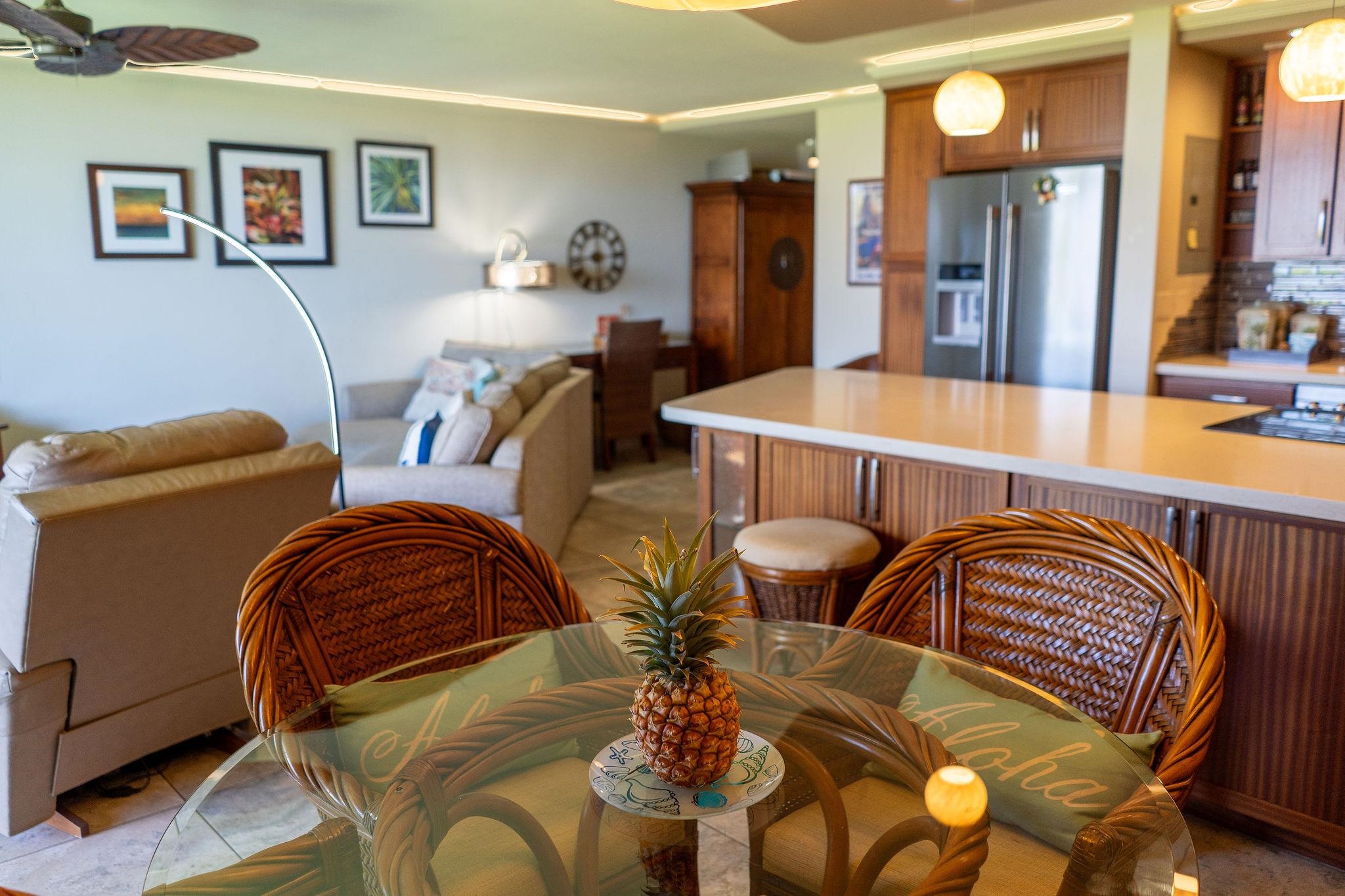 1032 South Kihei Road, Unit B420 Kihei, HI 96753 - Photo 9 of 47 a dining room with furniture and wooden floor