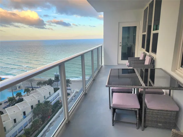 a view of a balcony with chairs