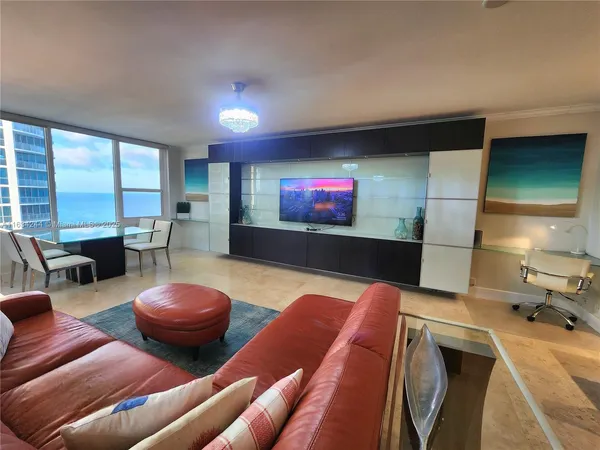 a living room with furniture and a flat screen tv
