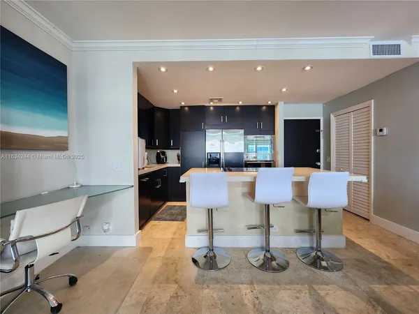 a living room with kitchen furniture and a table