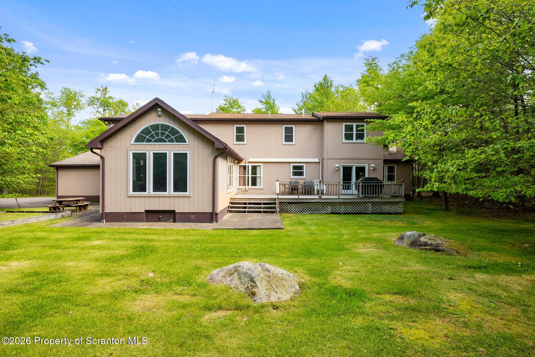 58 Bender Road Gouldsboro, PA 18424 - Photo 46 of 55 a front view of a house with a garden
