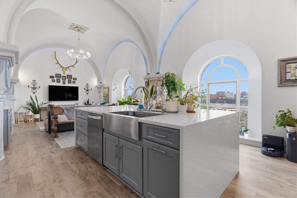 1 Pius Street, Unit B4 Pittsburgh, PA 15203 - Photo 12 of 41 a living room with furniture a flat screen tv and a fireplace