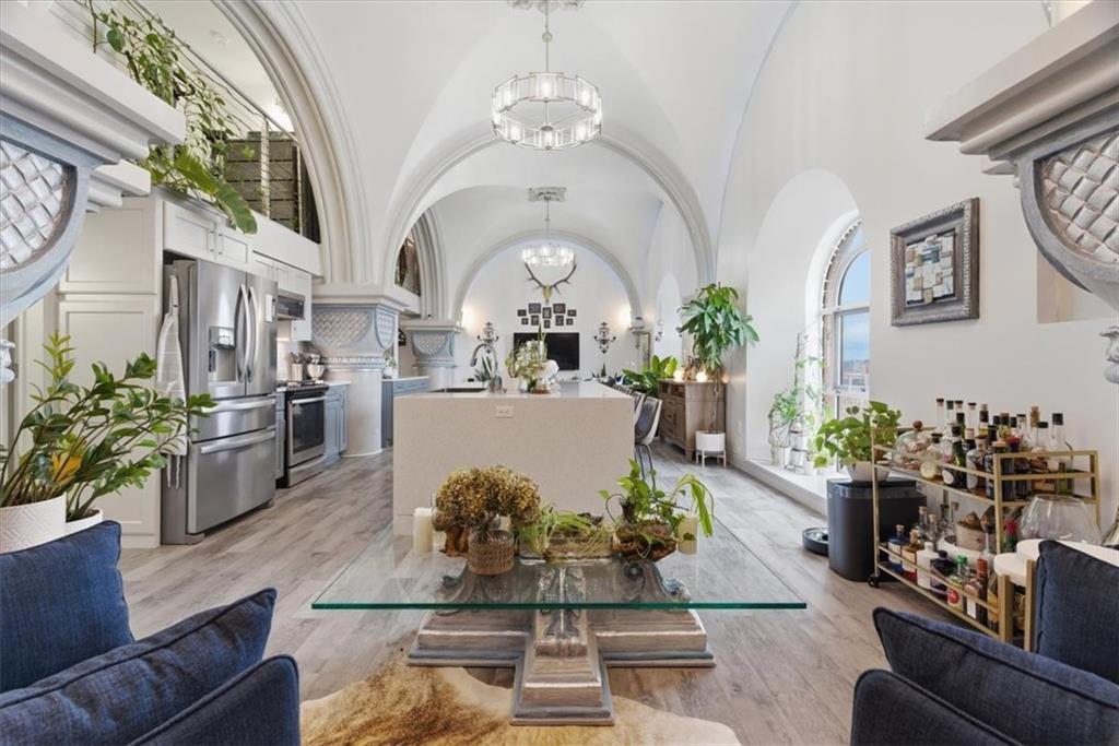 1 Pius Street, Unit B4 Pittsburgh, PA 15203 - Photo 13 of 41 a living room with furniture flowers and a chandelier