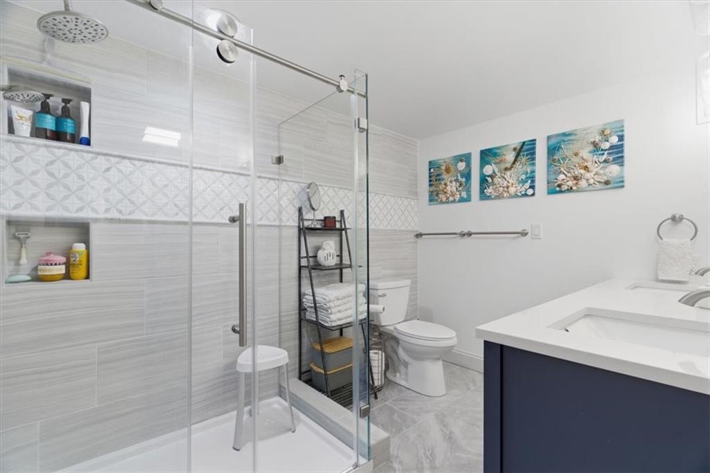 1 Pius Street, Unit B4 Pittsburgh, PA 15203 - Photo 22 of 41 a bathroom with a sink a toilet and shower