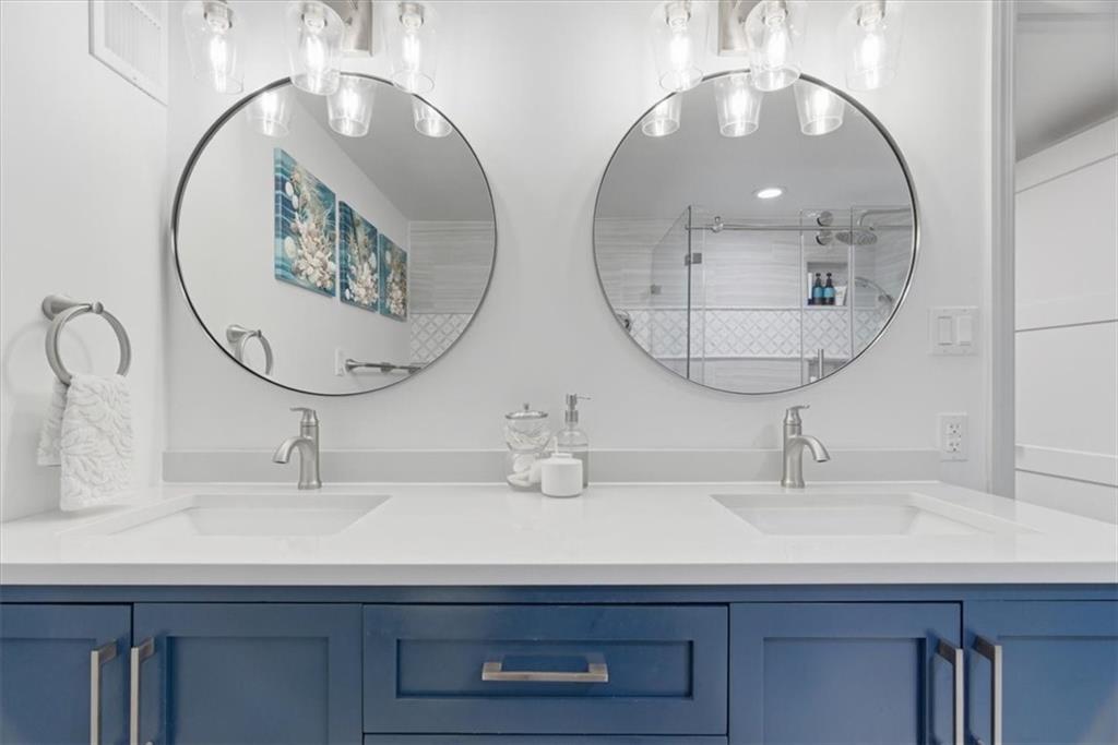 1 Pius Street, Unit B4 Pittsburgh, PA 15203 - Photo 23 of 41 a bathroom with a double vanity sink and a mirror