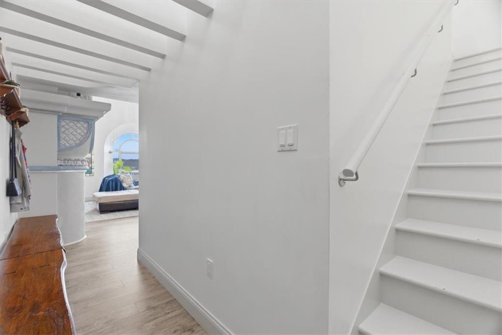 1 Pius Street, Unit B4 Pittsburgh, PA 15203 - Photo 25 of 41 a hallway with stairs and a couch