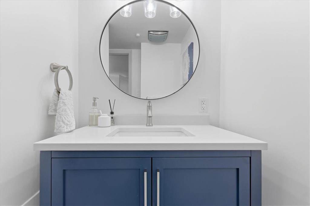 1 Pius Street, Unit B4 Pittsburgh, PA 15203 - Photo 32 of 41 a bathroom with a sink and a mirror