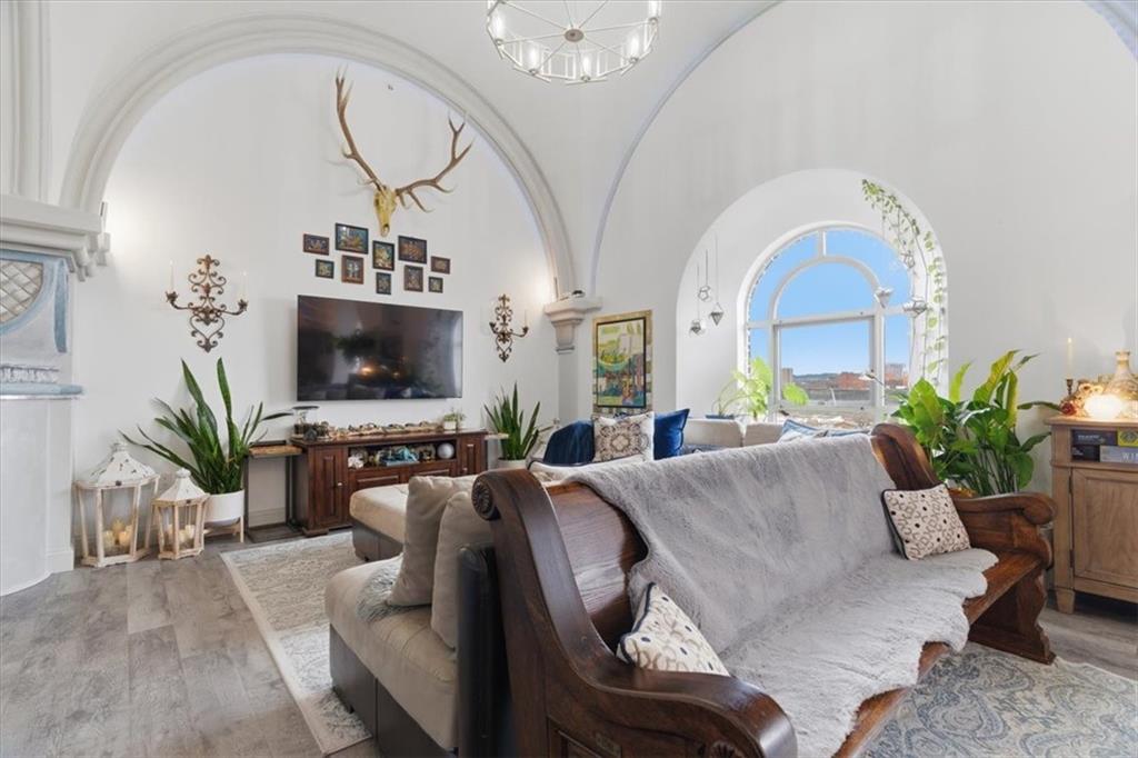 1 Pius Street, Unit B4 Pittsburgh, PA 15203 - Photo 6 of 41 a living room with furniture a large window and a flat screen tv