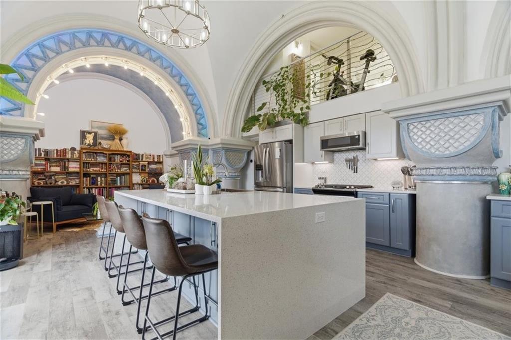 1 Pius Street, Unit B4 Pittsburgh, PA 15203 - Photo 8 of 41 a kitchen with stainless steel appliances a table and chairs