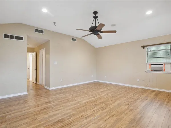 a bathroom with a bathtub sink and mirror