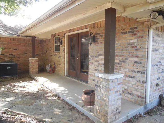 a view of a porch with seating space