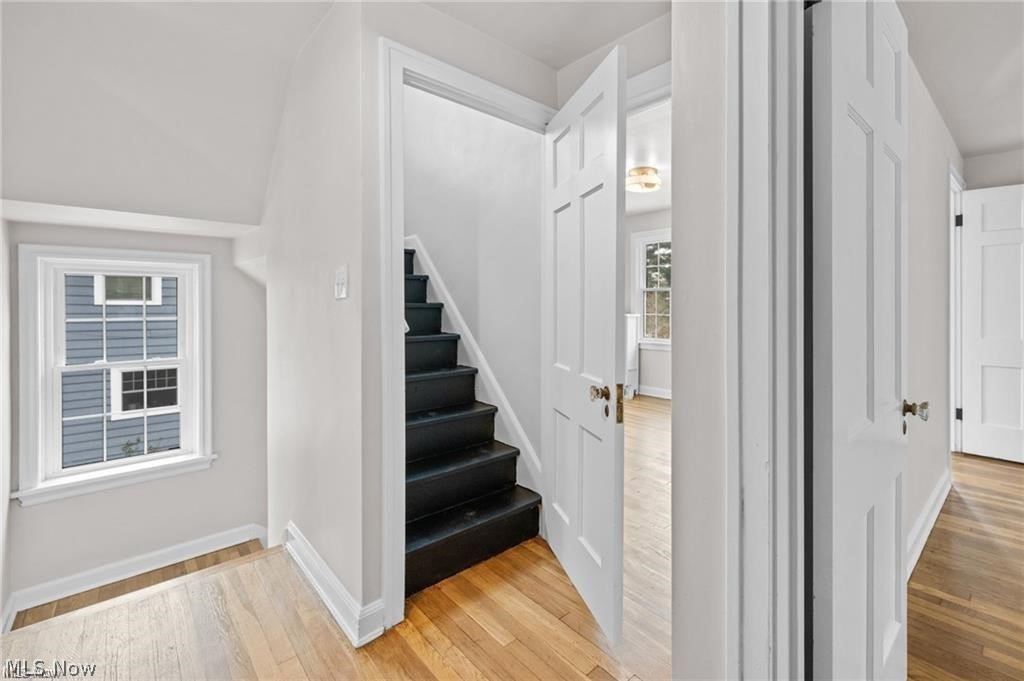 3145 Huntington Road Shaker Heights, OH 44120 - Photo 24 of 28 Hallway featuring wood-finish flooring, white trim, and a window with a double-hung design