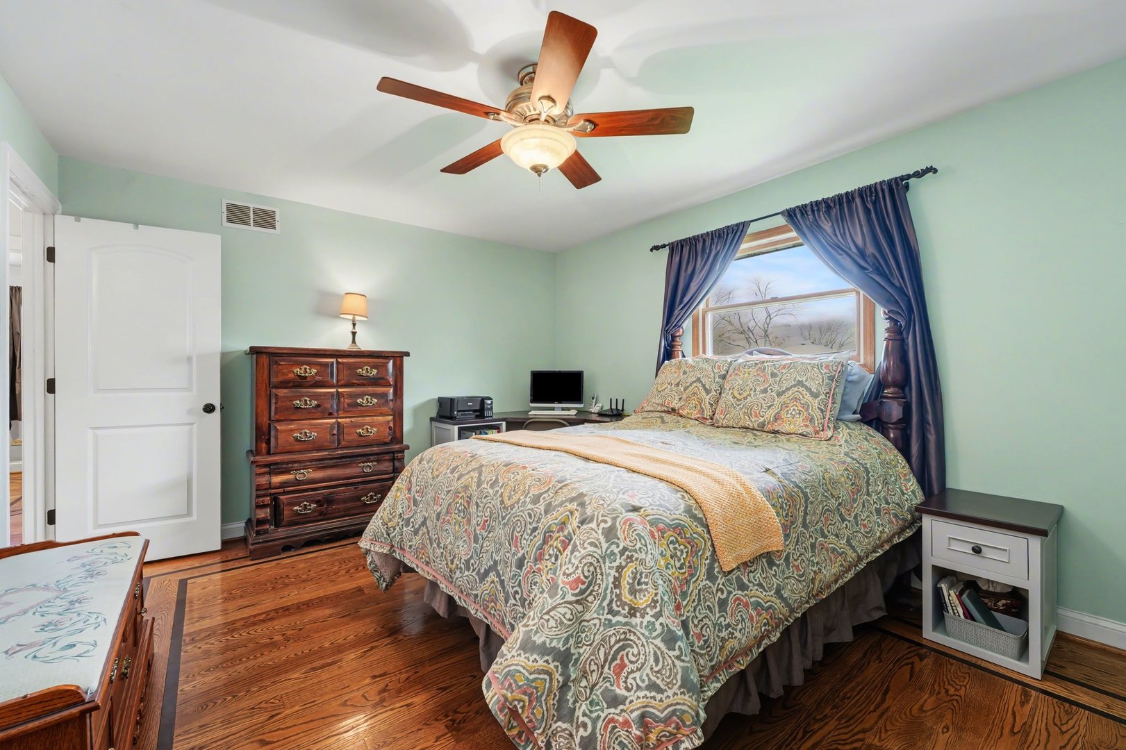 3604 192nd Street Lansing, IL 60438 - Photo 14 of 29 a bedroom with a bed a dresser and a couch