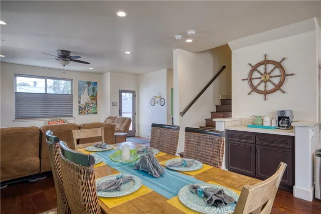 a kitchen with granite countertop a sink stove and refrigerator