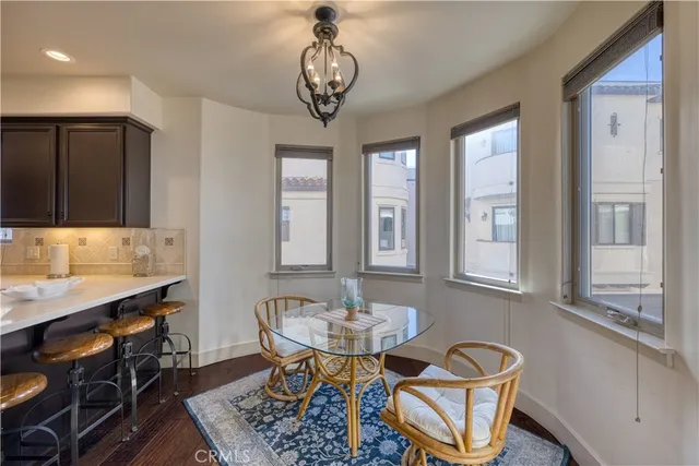 a kitchen with granite countertop stainless steel appliances and wooden cabinets