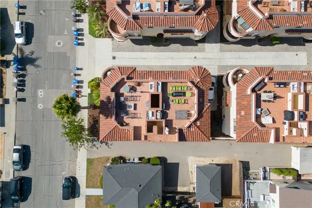 a view of a terrace with lawn chairs