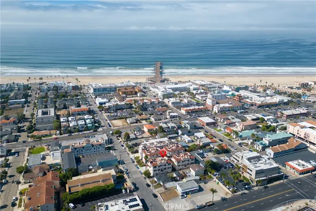 a living room with furniture ceiling fan and a window