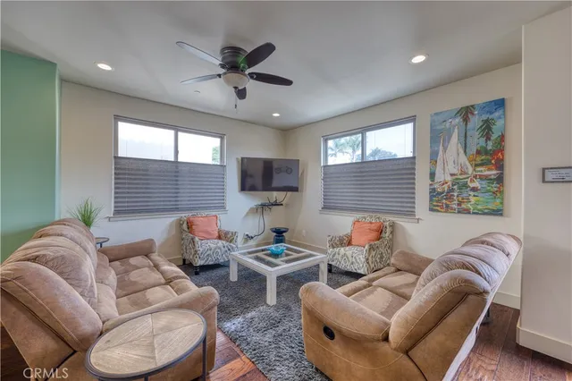 a view of a livingroom with furniture and a window
