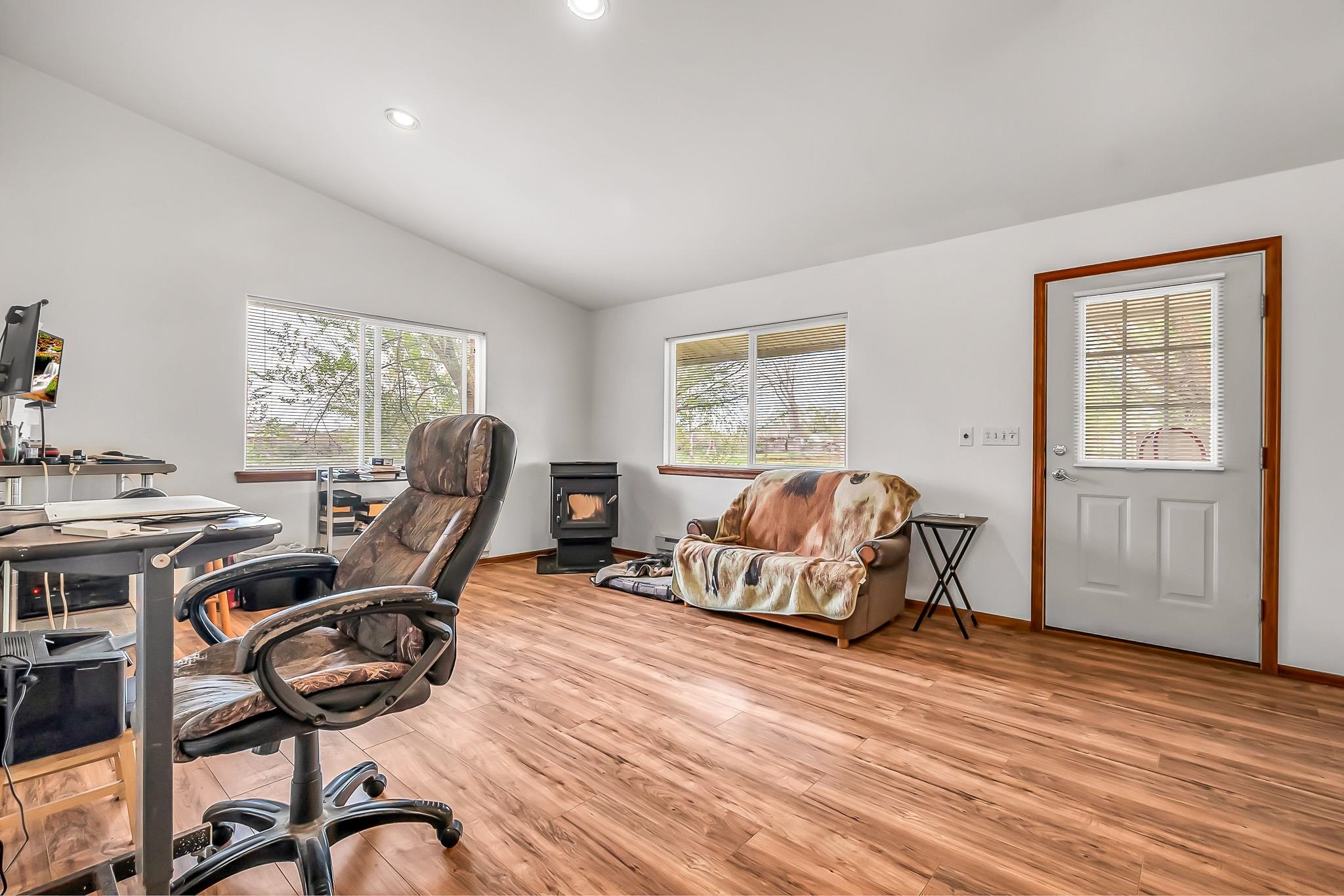 2075 I Road Fruita, CO 81521 - Photo 34 of 42 a living room with furniture and a wooden floor