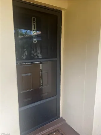 a kitchen with a sink cabinets and appliances