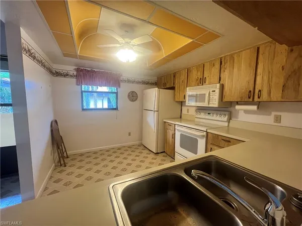 a bathroom with a sink toilet tub and shower