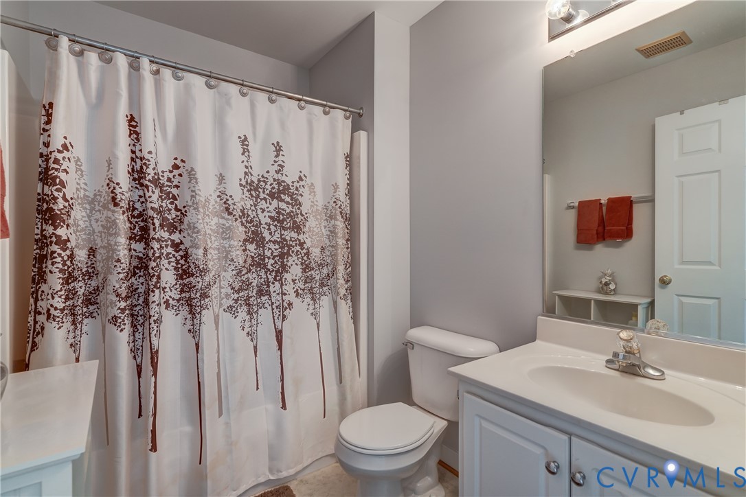 7902 Johnson Road Petersburg, VA 23805 - Photo 45 of 55 Bathroom featuring a vanity with a white counterto