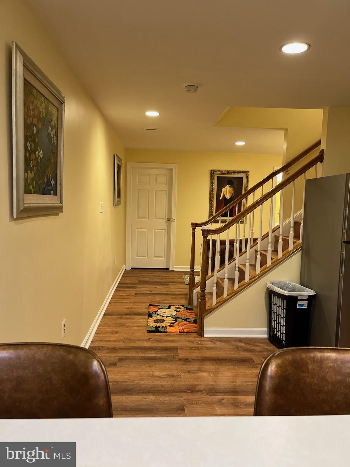 7288 Flaxpool Court Hanover, MD 21076 - Photo 22 of 23 a view of a livingroom with furniture & staircase