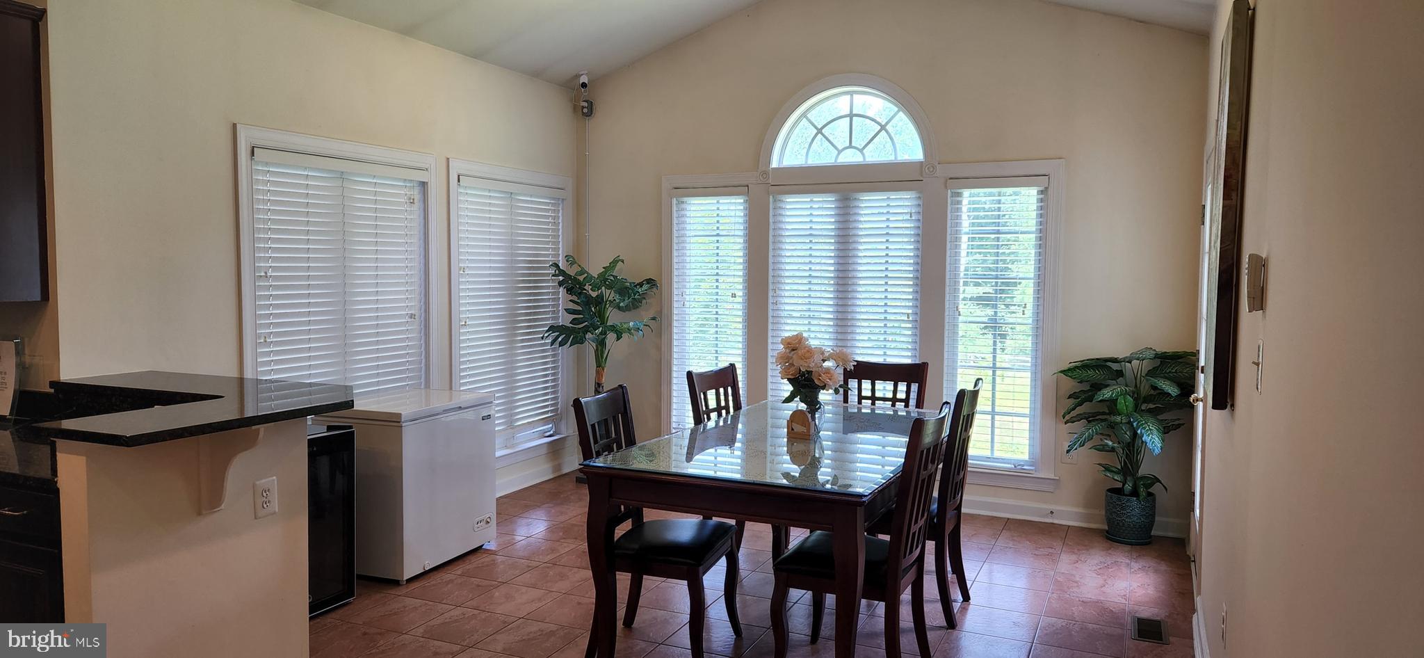 7288 Flaxpool Court Hanover, MD 21076 - Photo 4 of 23 a view of a dining room with furniture and window
