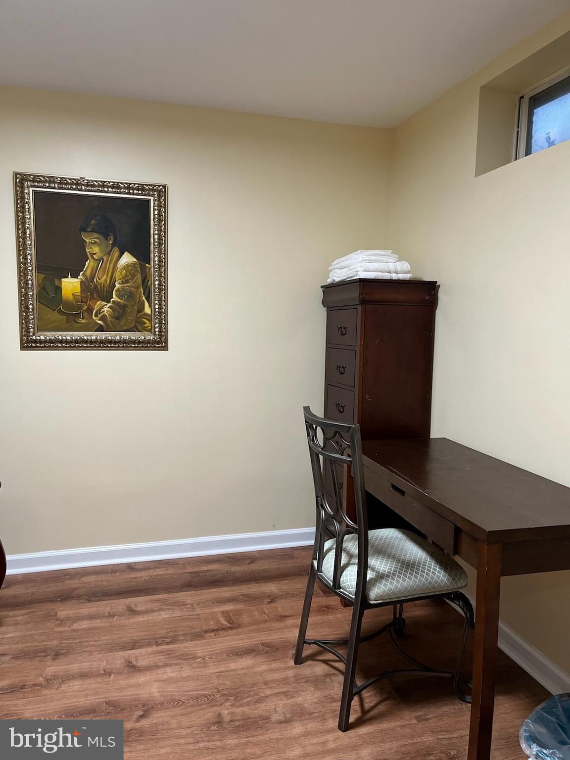 7288 Flaxpool Court Hanover, MD 21076 - Photo 9 of 23 a workspace with furniture and wooden floor