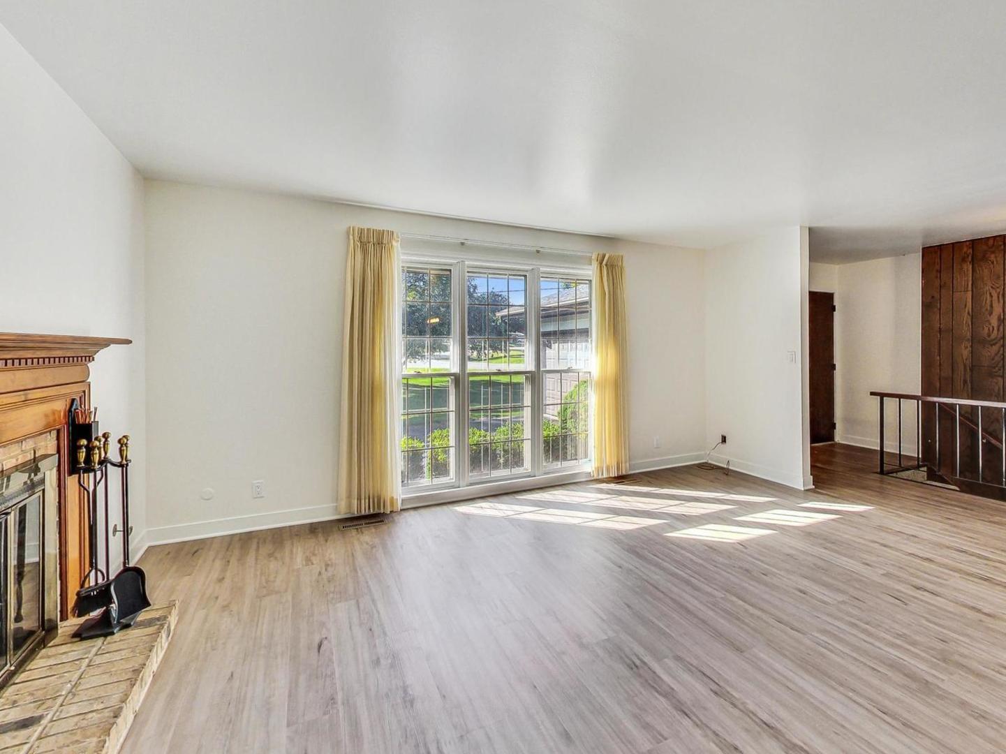 4618 William Street Johnsburg, IL 60051 - Photo 11 of 40 an empty room with wooden floor and a window