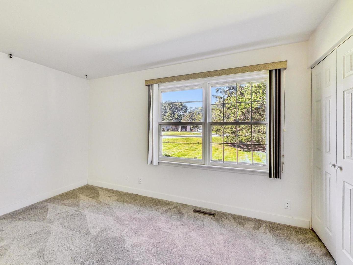 4618 William Street Johnsburg, IL 60051 - Photo 13 of 40 a view of an empty room with a window