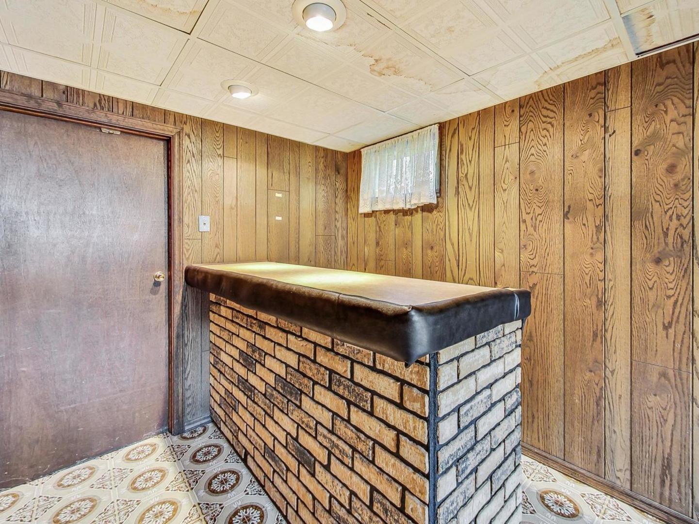 4618 William Street Johnsburg, IL 60051 - Photo 27 of 40 a room with a bed and a dresser