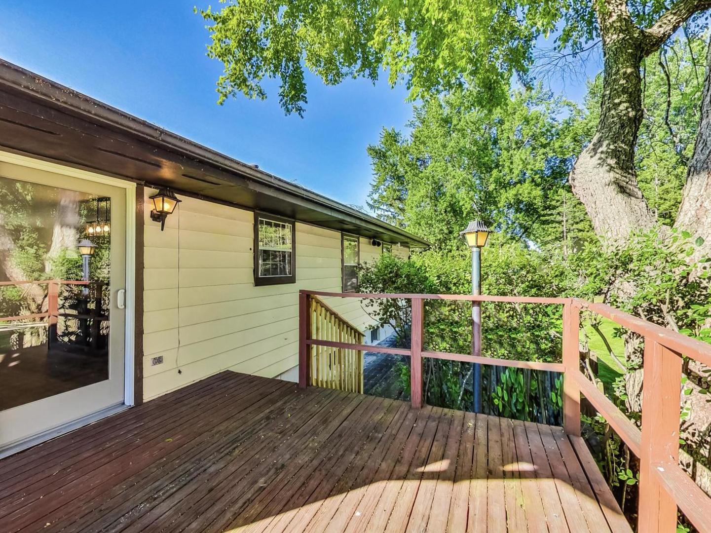 4618 William Street Johnsburg, IL 60051 - Photo 32 of 40 a view of balcony with wooden floor and fence