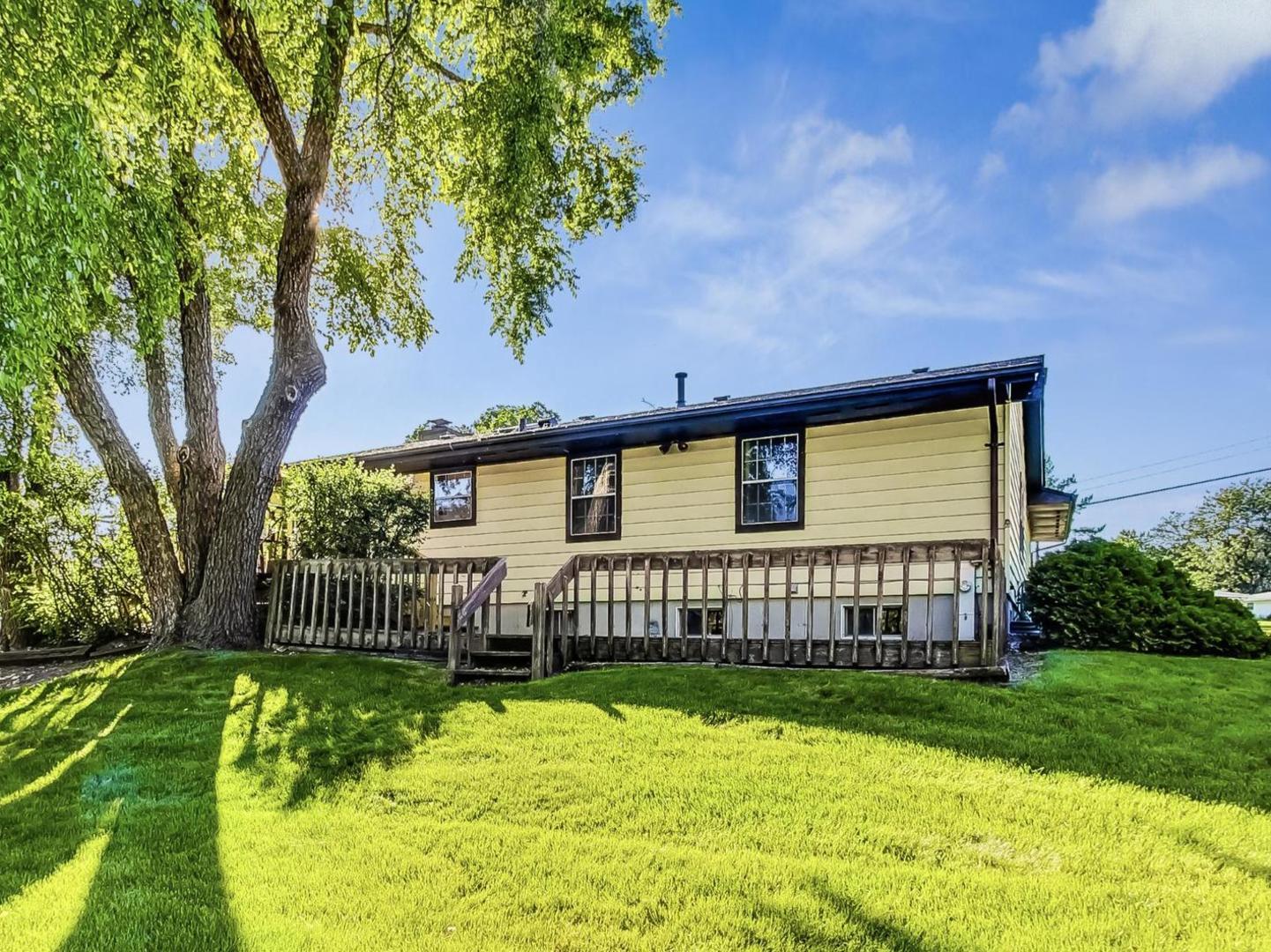 4618 William Street Johnsburg, IL 60051 - Photo 33 of 40 a front view of a house having yard