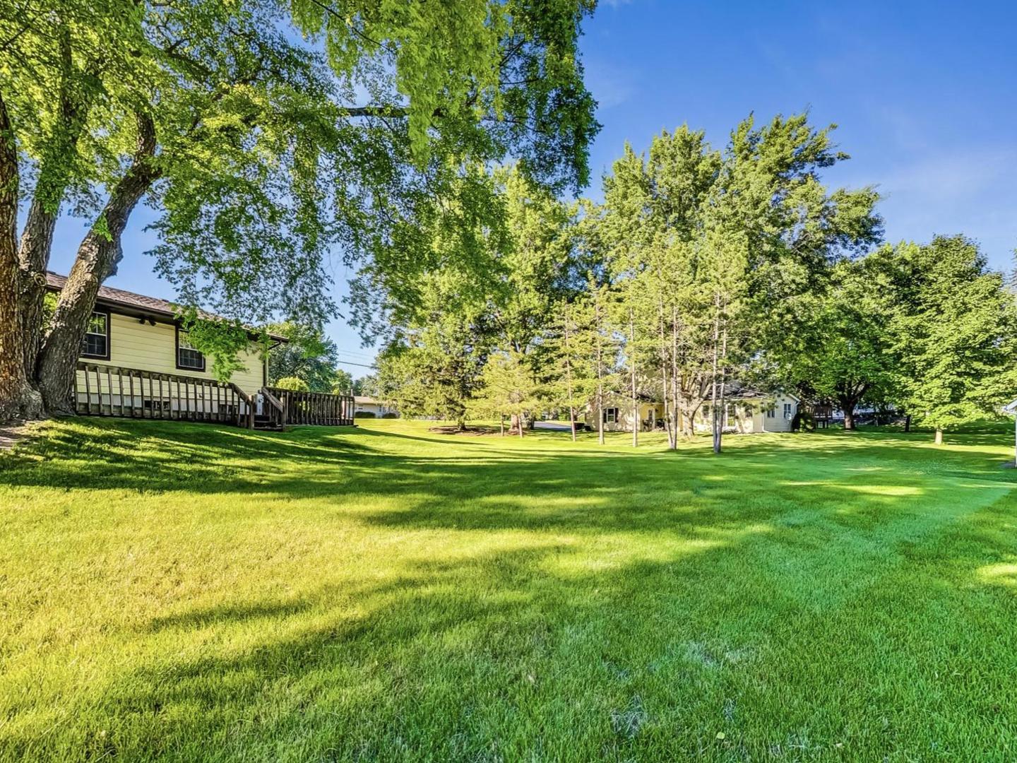 4618 William Street Johnsburg, IL 60051 - Photo 35 of 40 a view of swimming pool with lawn chairs and large trees