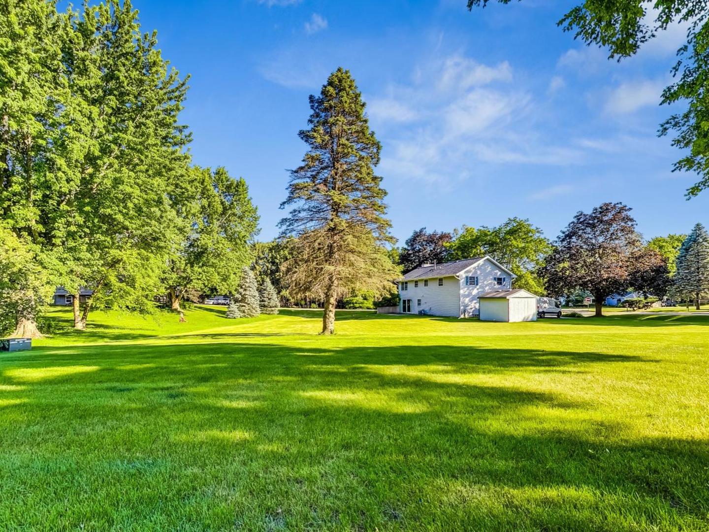 4618 William Street Johnsburg, IL 60051 - Photo 37 of 40 a big yard with lots of tress in front of it