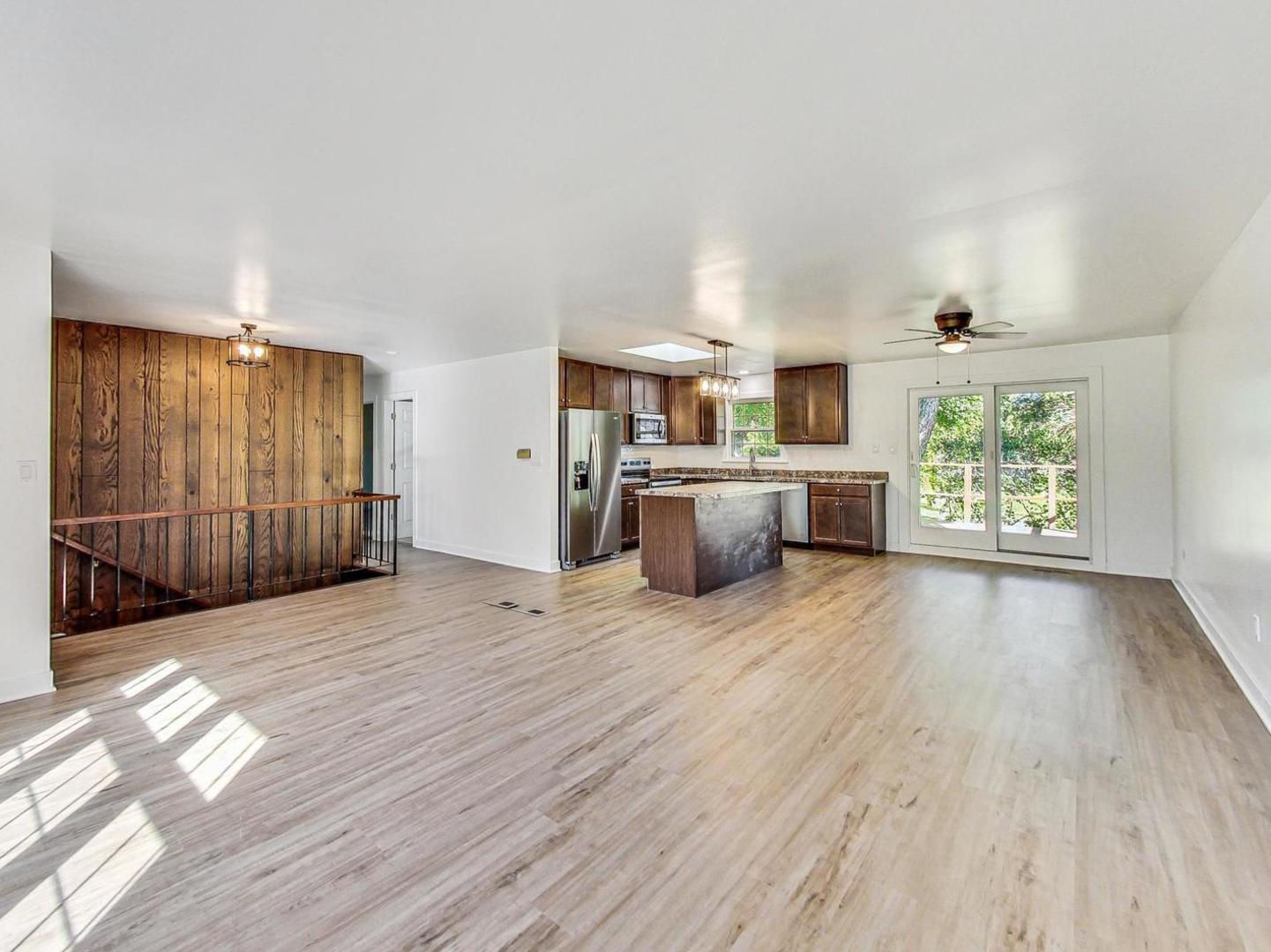 4618 William Street Johnsburg, IL 60051 - Photo 9 of 40 a view of empty room with wooden floor and windows