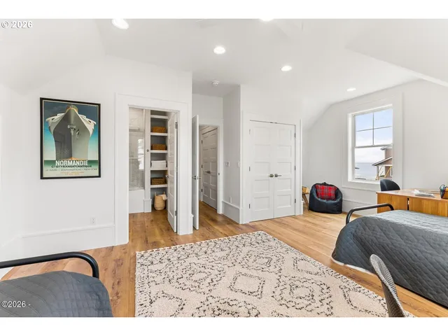 a bedroom with furniture and window