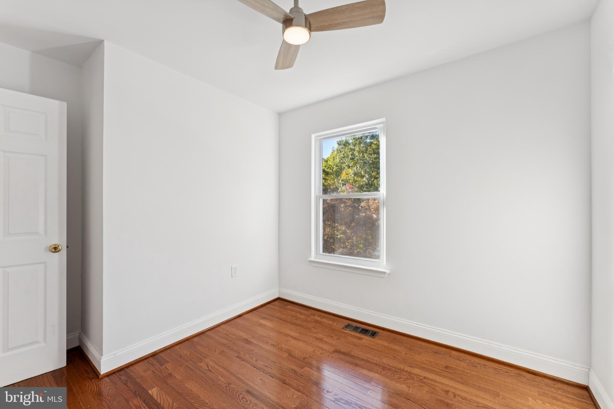 2107 High Timber Road Fort Washington, MD 20744 - Photo 16 of 30 an empty room with wooden floor and windows