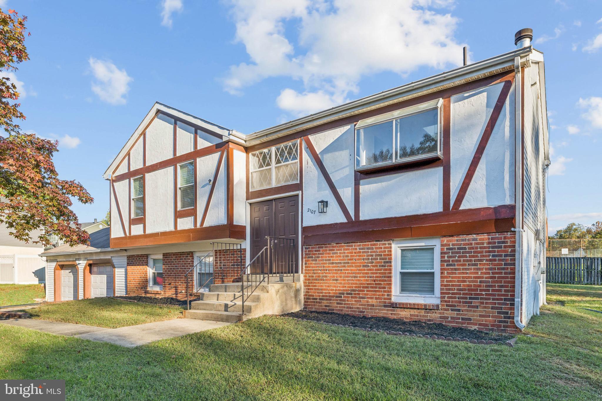 2107 High Timber Road Fort Washington, MD 20744 - Photo 3 of 30 a front view of a house with a yard