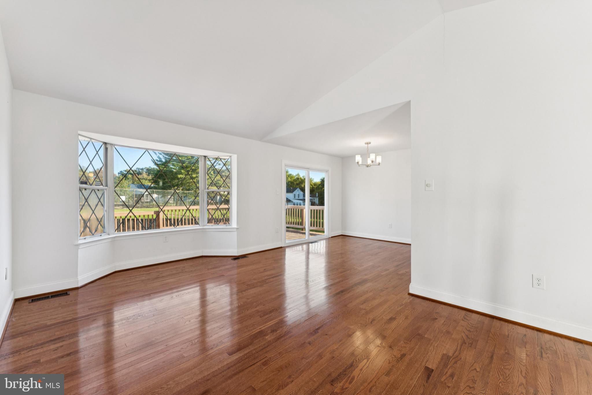 2107 High Timber Road Fort Washington, MD 20744 - Photo 4 of 30 a view of an empty room with wooden floor and a window