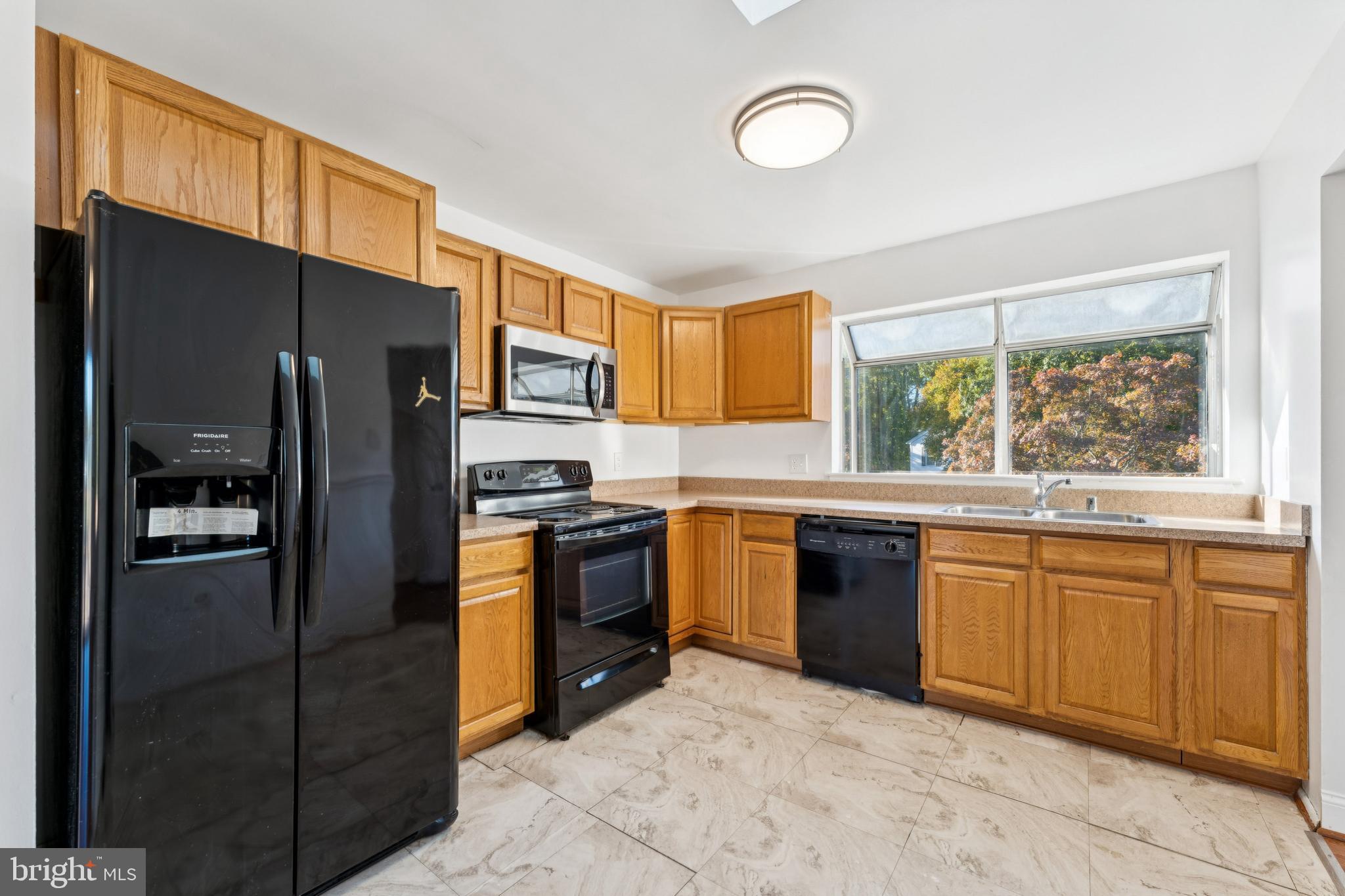 2107 High Timber Road Fort Washington, MD 20744 - Photo 9 of 30 a kitchen with stainless steel appliances granite countertop a refrigerator stove top oven and sink