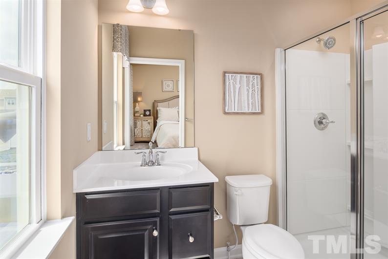 6612 Pathfinder Way Raleigh, NC 27616 - Photo 6 of 9 a bathroom with a sink toilet and shower