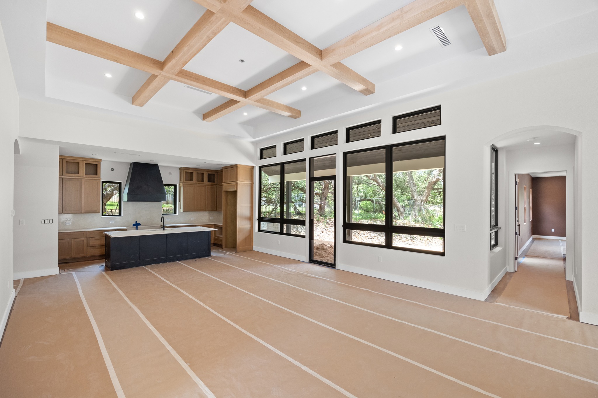 903 Flint Ridge Trail Georgetown, TX 78628 - Photo 4 of 39 Spacious open-concept interior featuring a coffered ceiling with wood-finish beams
